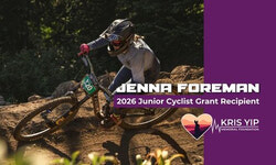 Young girl crushing a burm in a downhill mountain bike race.